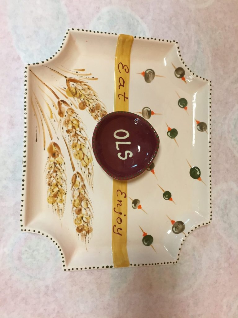 Hand-painted bread tray with golden wheat stalks, an "Eat Enjoy" ribbon and an OLS medallion