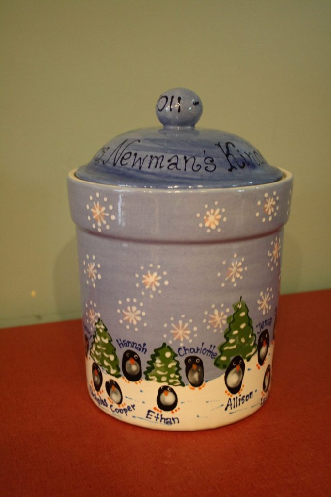Hand-painted lidded kindergarten canister with fingerprint penguins, pine trees and snowflakes on blue