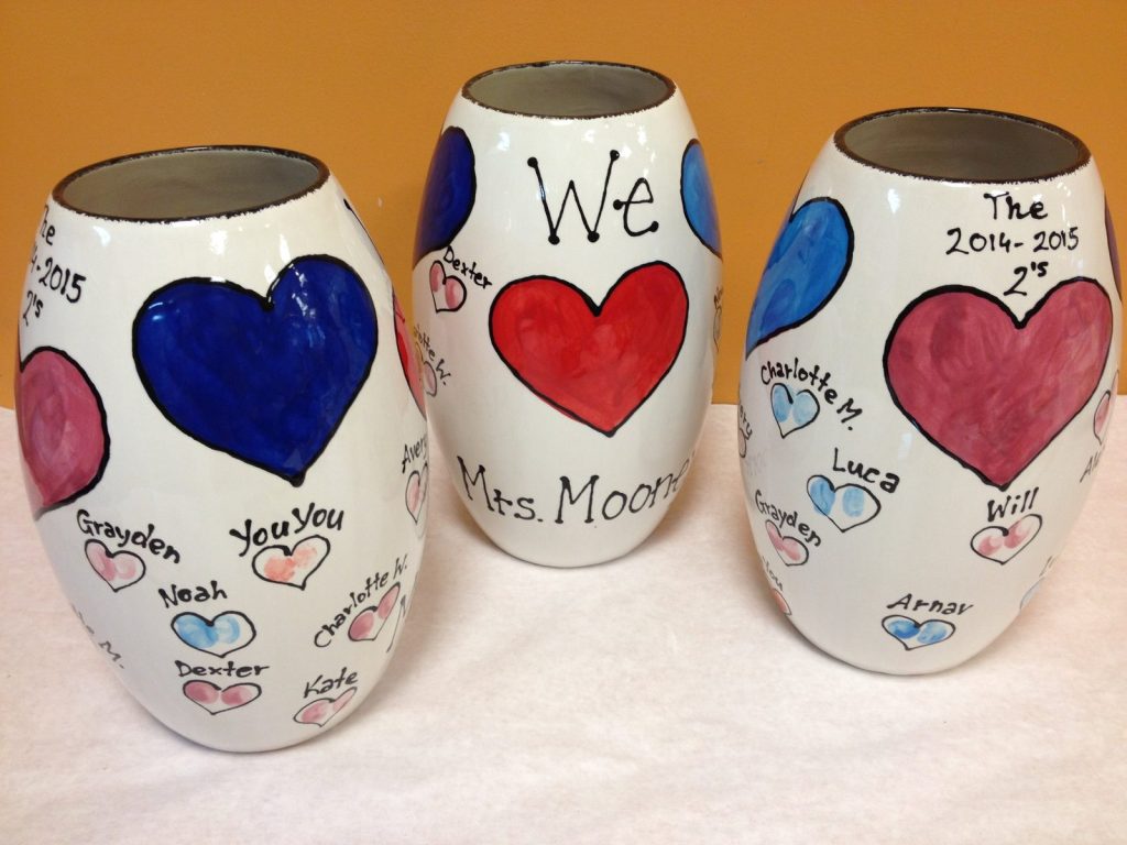 Three hand-painted vases with big red, blue and purple hearts and children's names, 2014–2015