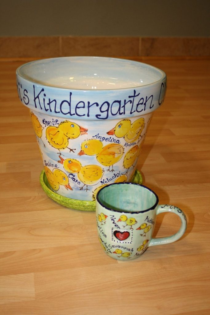 Hand-painted kindergarten flowerpot with fingerprint chicks, a saucer and a small matching mug