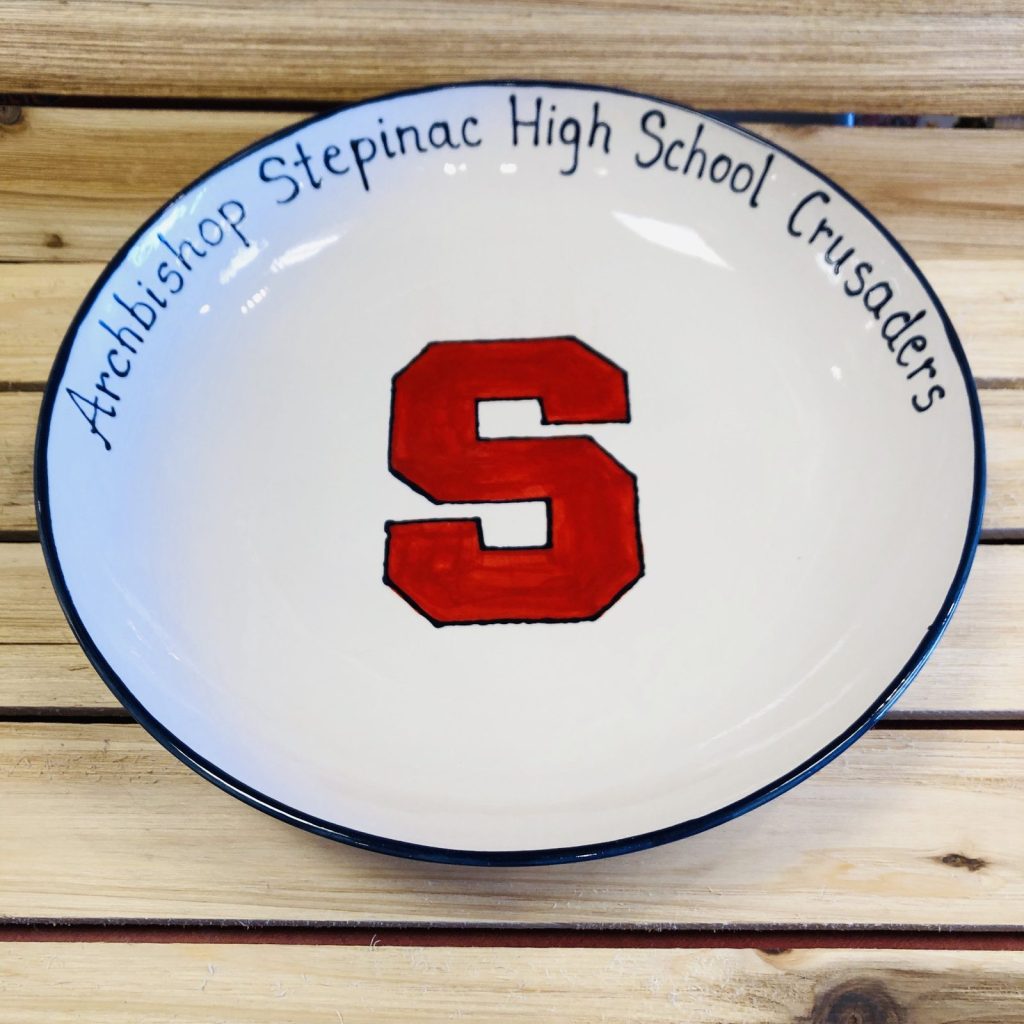 Hand-painted round platter for the Archbishop Stepinac High School Crusaders with a red block S
