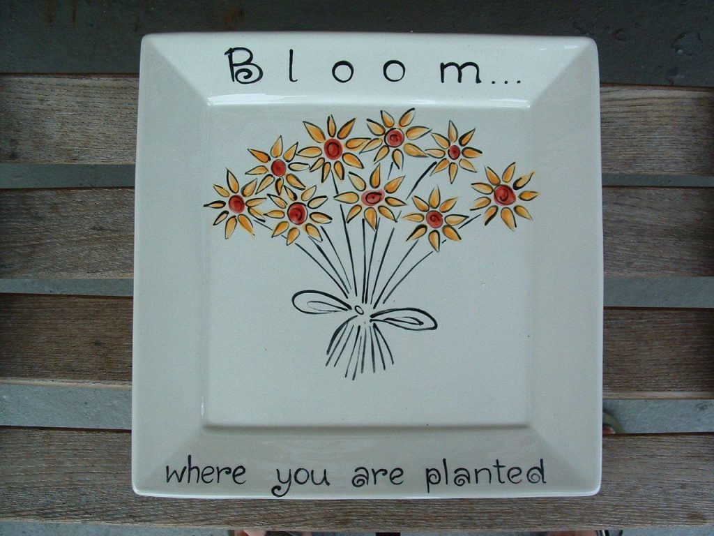 Hand-painted square "Bloom where you are planted" plate with a bouquet of orange fingerprint flowers