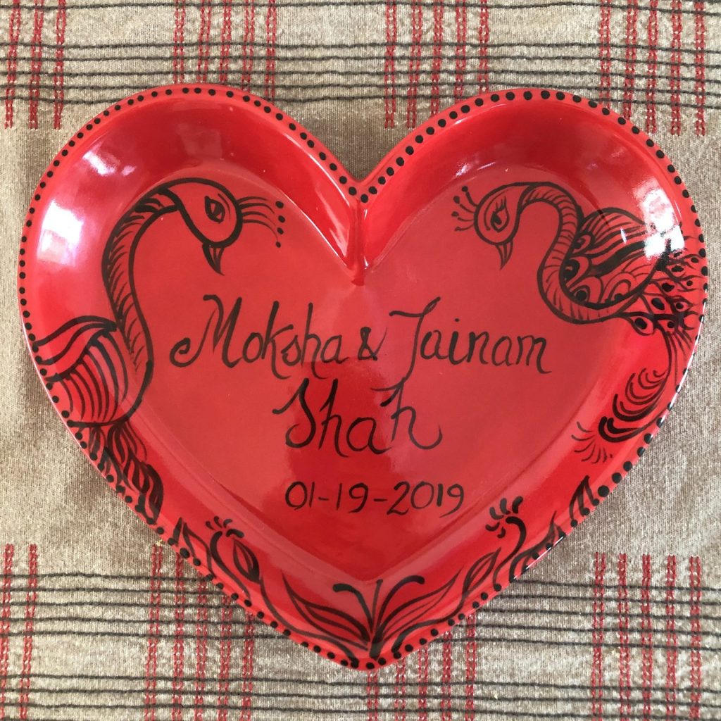 Hand-painted red heart platter with black peacock line art, a couple's names, and a 2019 date